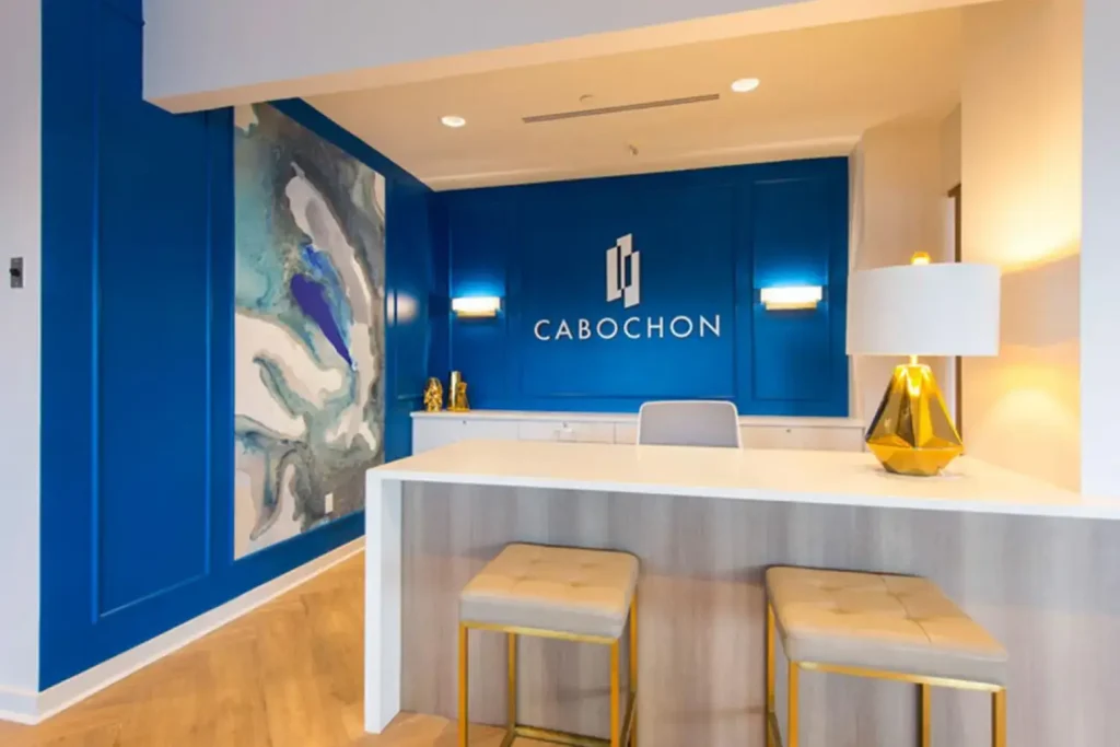 Leasing office with a sign "CABOCHON" in the background